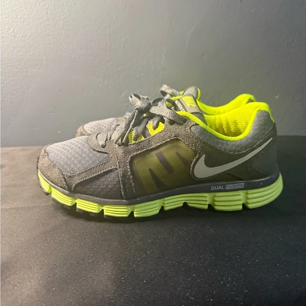 Nike women’s Gray and Neon Green Dual Fusion Sneakers